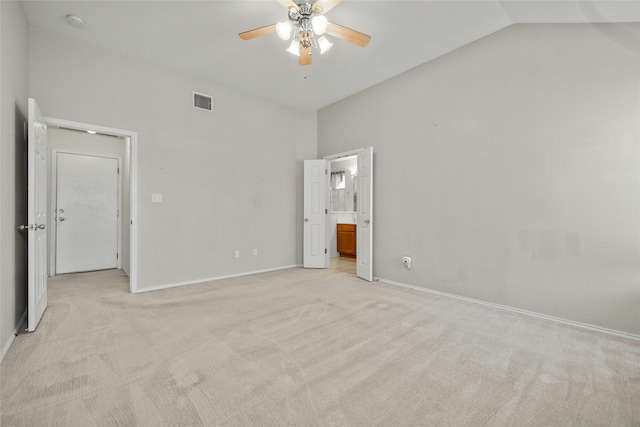 unfurnished bedroom featuring ceiling fan, light carpet, and lofted ceiling