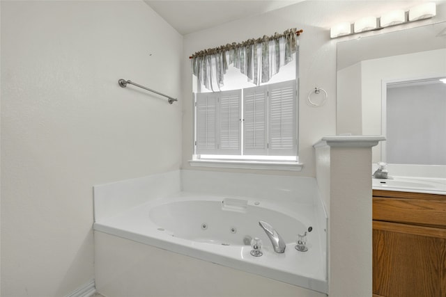 bathroom featuring a tub and vanity