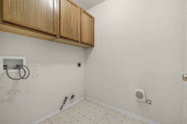 washroom with cabinets, hookup for an electric dryer, hookup for a gas dryer, and washer hookup