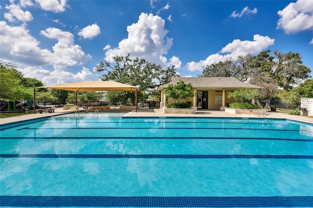 view of swimming pool with a patio area