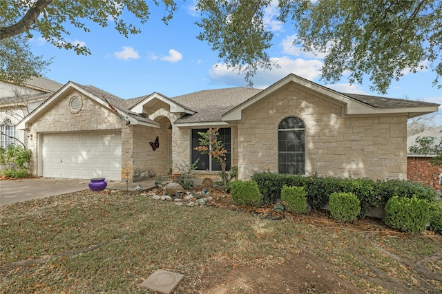 ranch-style house featuring a front yard and a garage