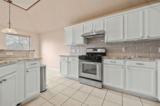 kitchen featuring white cabinets, light tile patterned floors, stainless steel range with gas stovetop, and tasteful backsplash