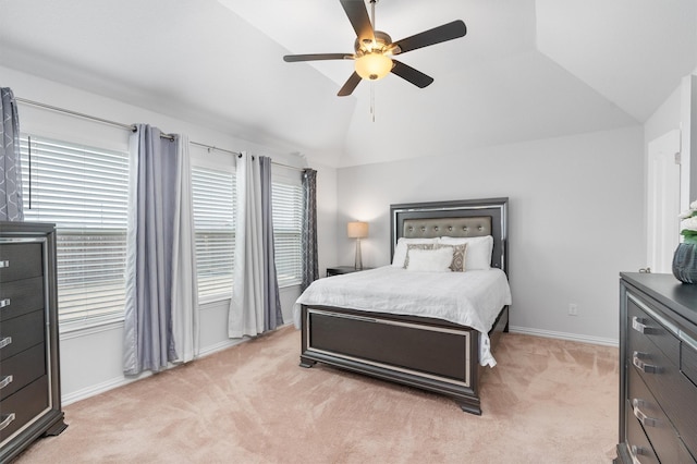 carpeted bedroom featuring vaulted ceiling and ceiling fan