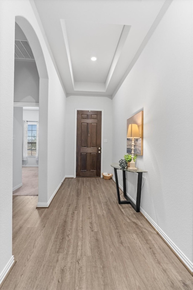 foyer entrance with light hardwood / wood-style floors