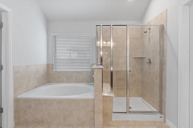 bathroom featuring tile patterned floors, vaulted ceiling, and plus walk in shower