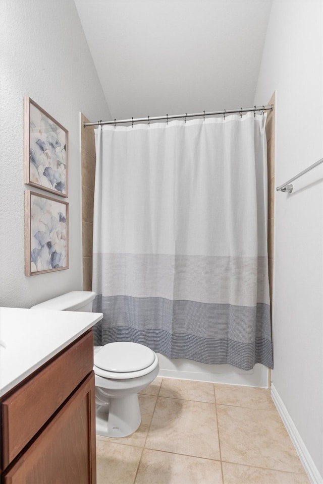 full bathroom with vaulted ceiling, toilet, tile patterned floors, shower / bath combination with curtain, and vanity