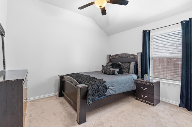 carpeted bedroom featuring lofted ceiling and ceiling fan