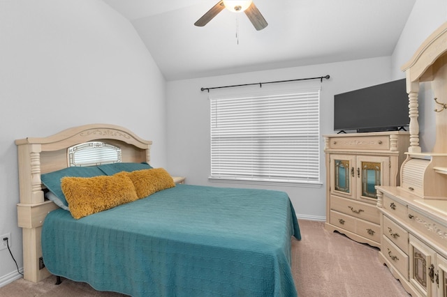 bedroom featuring vaulted ceiling, ceiling fan, and light carpet