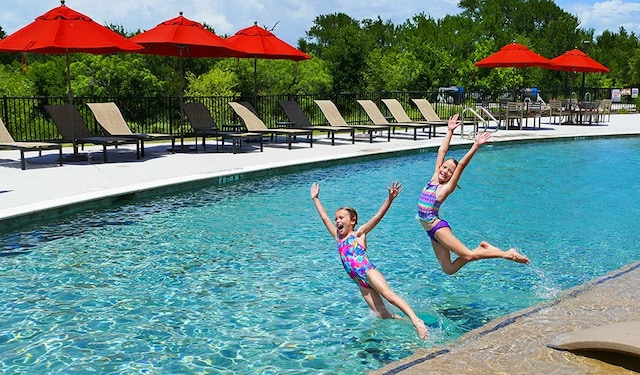 view of swimming pool with a patio