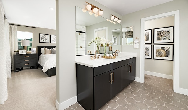 bathroom with vanity, an enclosed shower, and plenty of natural light