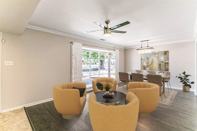 living room featuring ceiling fan and ornamental molding