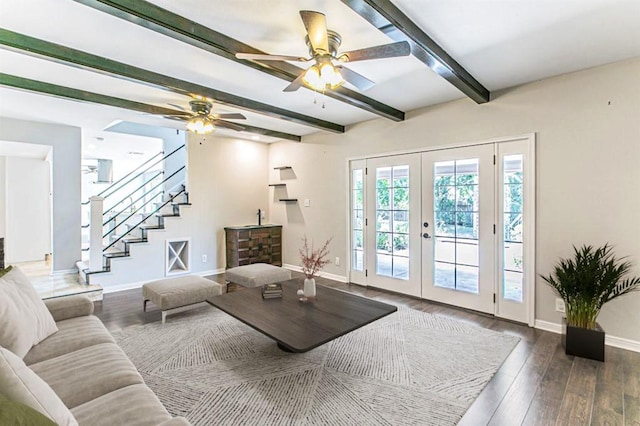 living room with french doors, ceiling fan, beamed ceiling, and dark wood-type flooring