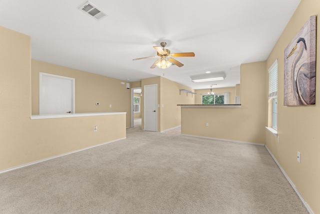 carpeted empty room with ceiling fan