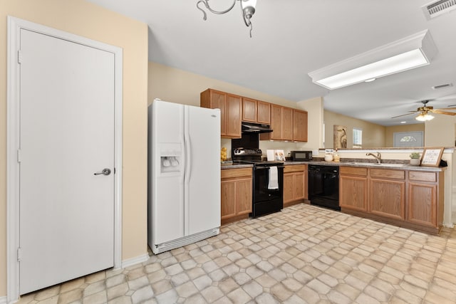 kitchen featuring sink, ceiling fan with notable chandelier, and black appliances