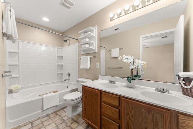 full bathroom with toilet, vanity, and washtub / shower combination