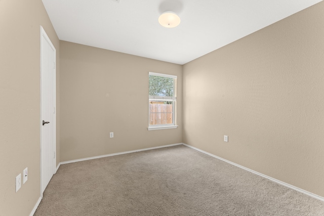 unfurnished room featuring carpet