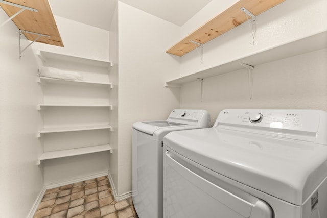 clothes washing area with independent washer and dryer