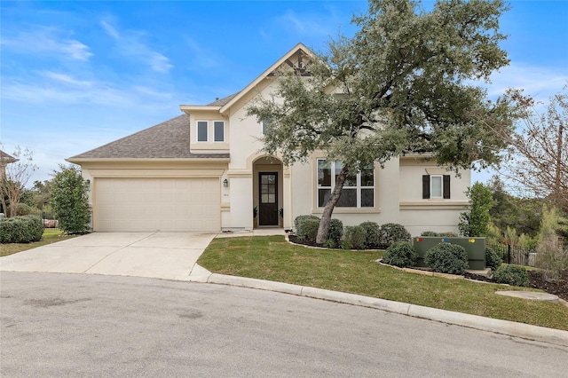 view of front of home with a garage and a front lawn