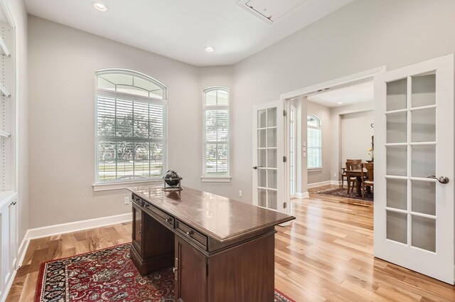 office space featuring light hardwood / wood-style floors and french doors