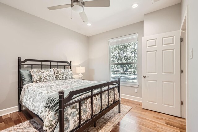 bedroom featuring ceiling fan and light hardwood / wood-style flooring