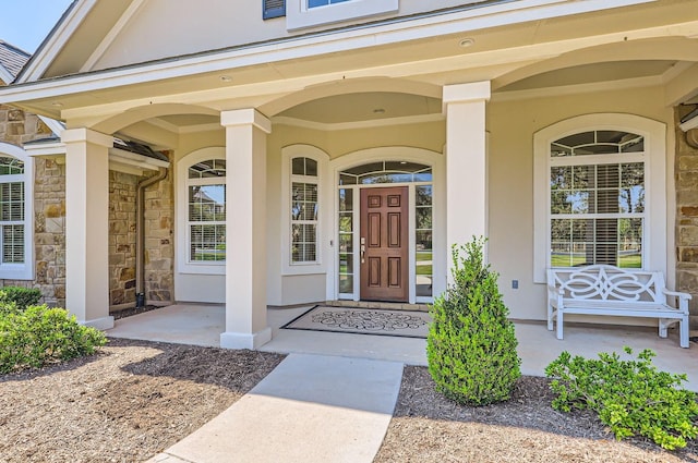 property entrance with covered porch