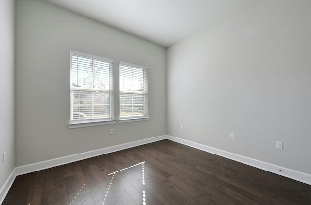 unfurnished room featuring dark hardwood / wood-style floors