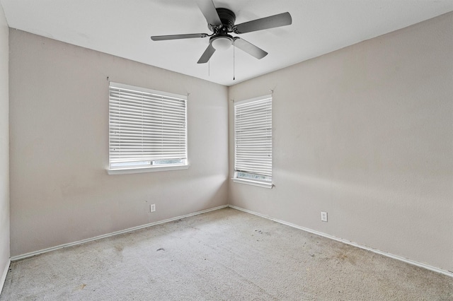 carpeted empty room with ceiling fan