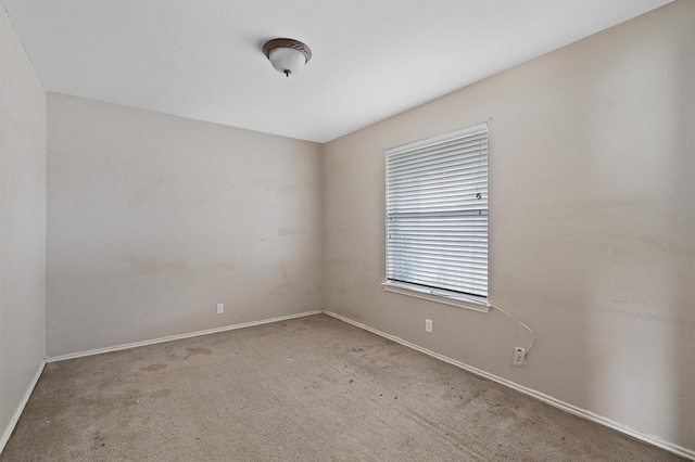 unfurnished room with light carpet