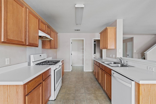 kitchen with white appliances and sink