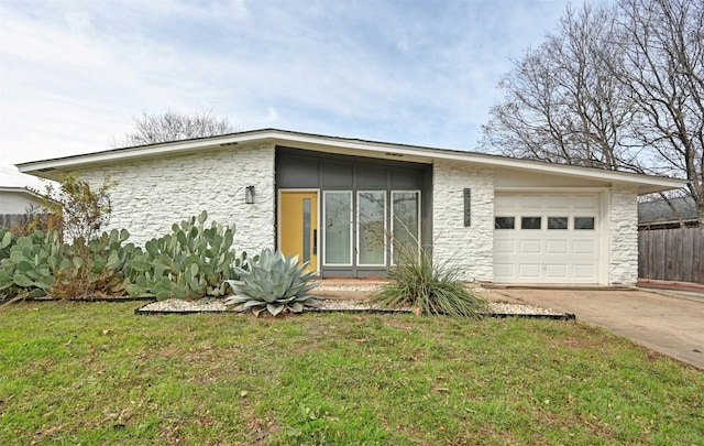 exterior space featuring a front yard and a garage