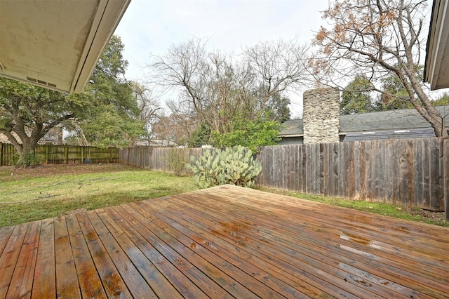 wooden deck with a yard