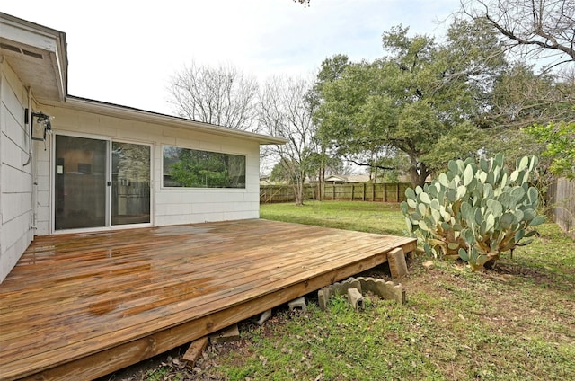 wooden terrace with a yard