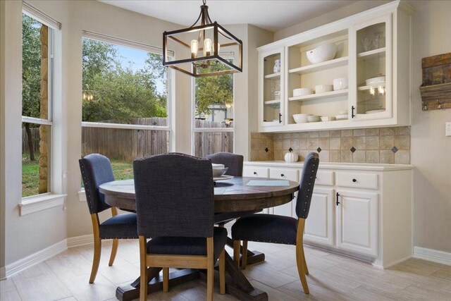 dining space featuring a notable chandelier