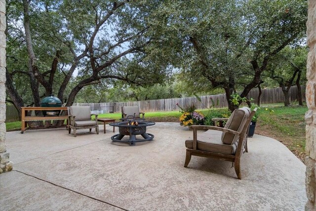 view of patio / terrace with an outdoor fire pit