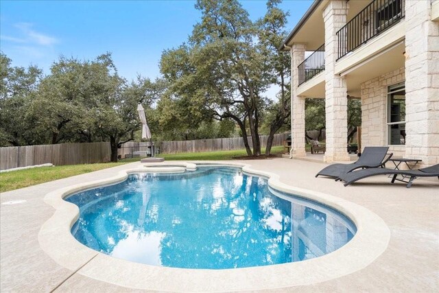 view of swimming pool featuring a patio area