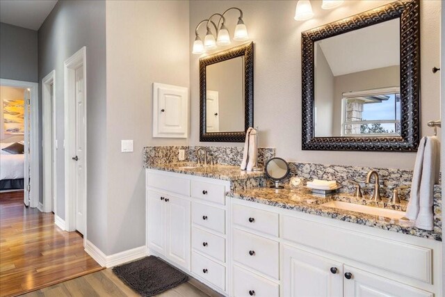 bathroom featuring hardwood / wood-style flooring and vanity