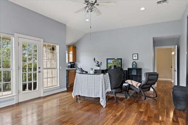 interior space with vaulted ceiling, ceiling fan, and dark hardwood / wood-style flooring