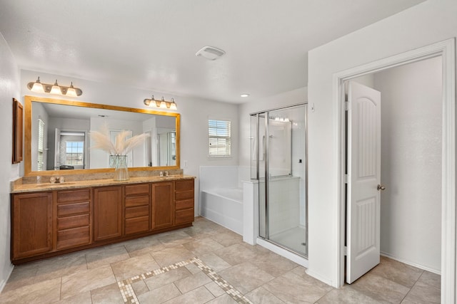 bathroom featuring separate shower and tub and vanity