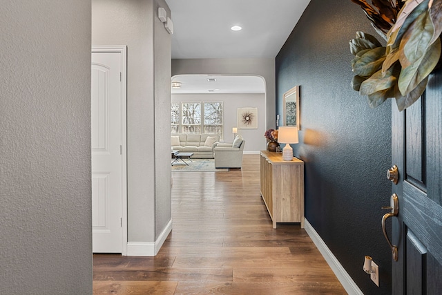 corridor featuring wood-type flooring