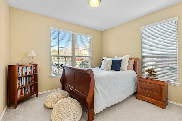 bedroom with light carpet