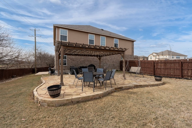 rear view of house with a lawn, a pergola, and a patio