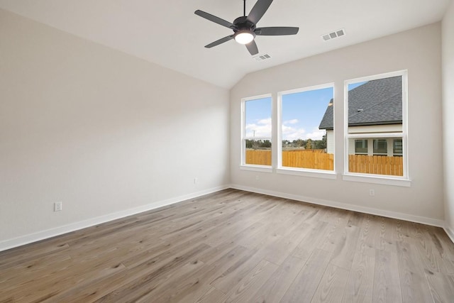 unfurnished room featuring light hardwood / wood-style floors, ceiling fan, and lofted ceiling