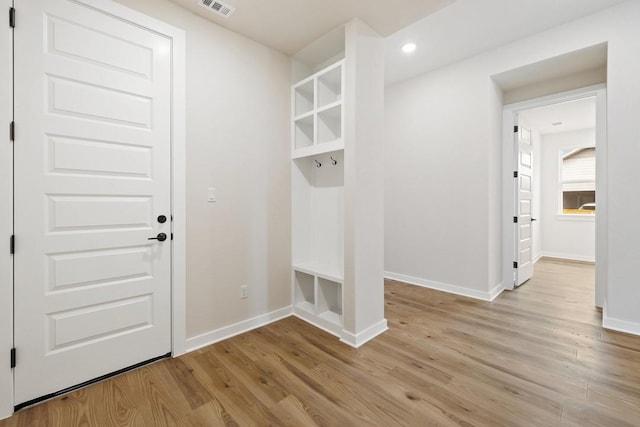 mudroom with light hardwood / wood-style flooring