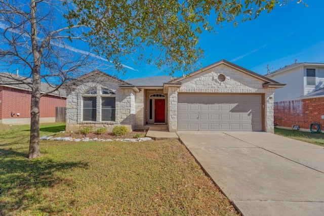 single story home with a front yard and a garage