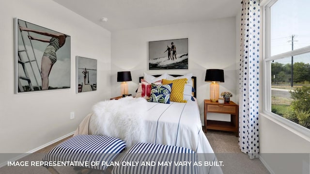 bedroom featuring multiple windows and carpet floors