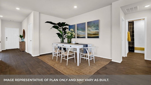 dining area with dark hardwood / wood-style floors