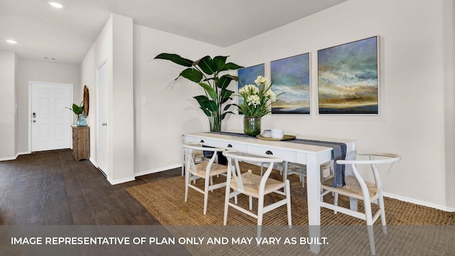 dining area with dark hardwood / wood-style floors