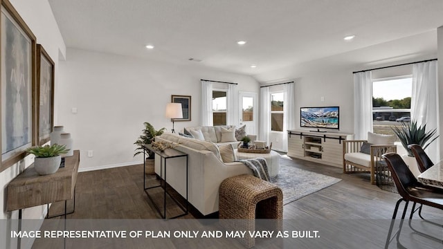 living room featuring dark hardwood / wood-style flooring and lofted ceiling