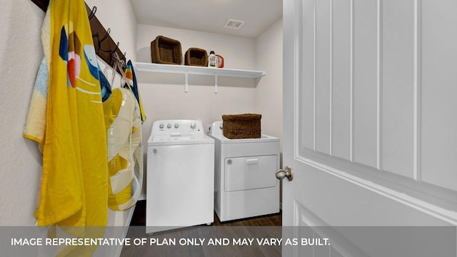 laundry area with washing machine and dryer