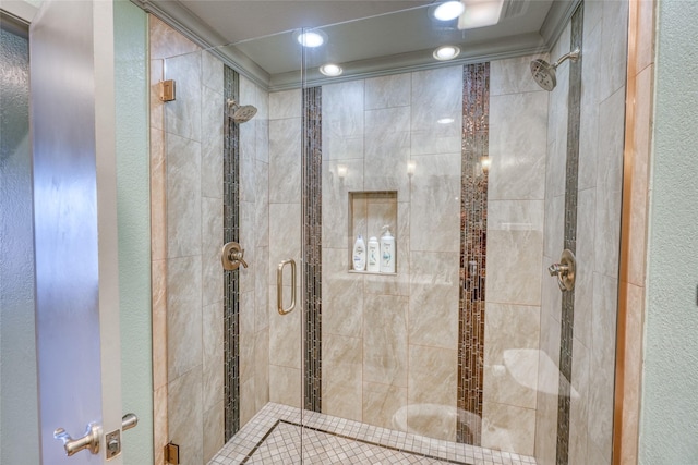 bathroom with walk in shower and ornamental molding